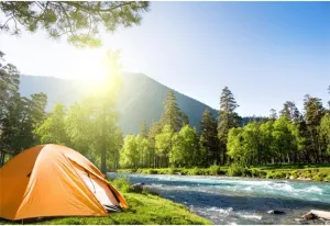 AOFOTO 9x6ft Outdoor Camping Backdrop Mountain Forest Creekside Camp Tents Sunshine Photography Background Summer Hiking Trip School Travel Nature Landscape Birthday Party Decors Photoshoot Props